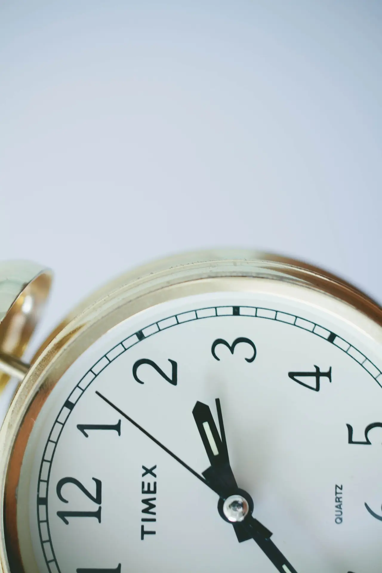 Close-up of a clock face counting down to a deadline